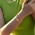Elegant gold plated snake bracelet with mesh texture worn by a model in lifestyle setting - Snake Scale Texture Style (KB0538-4) / Gold