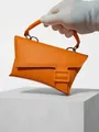 Vibrant orange crossbody waist bag featuring a stylish square buckle and detachable strap - Orange