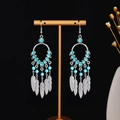 Bohemian silver feather tassel earrings with sky blue beads on gold display stand - Sky Blue Beaded Hollow Feather Tassel Style (E5225-2)