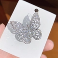 Macro shot of silver butterfly ring with hollow design and pave set white zircons - Silver White Zircon