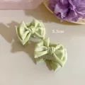 Set of two light mint green satin bow hair claws for small half-up hairstyles - 1 Piece / Yellow-Green