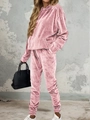 Detail view of pink velvet tracksuit with drawstring hoodie and jogger pants on model - S / Pink