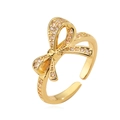 Elegant 18K gold-plated bow ring featuring sparkling cubic zirconia stones and open design - Partial Pave(14310)