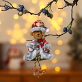 Teddy bear Christmas ornament with red plaid hat and bells hanging on a branch - Long Leg Bear