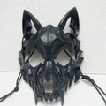 Macro shot of black wolf skull cosplay mask with sharp fangs and matte skeletal textures - Werewolf Black