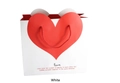 White paper gift bag with red heart pattern and rope handles for wedding or holiday packaging - White