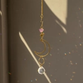 Golden suncatcher with amethyst raw stone and faceted crystal ball casting rainbows - Amethyst Moon Style