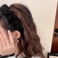 Elegant black fleece padded headband styled with a gold layered ring and pearl earring - Knitted Fabric Style / Black