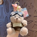 Cute brown plush teddy bear keychain wearing a yellow striped sweater and goggles - Scented - Coffee Brown (No Tag)