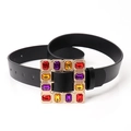 Fashionable black leather belt featuring a gold square buckle set with colorful crystals - Black