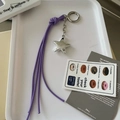 Porte-clés étoile tressé violet avec pendentif en argent et pompon au style Y2K - Violet