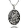 Detailed close-up of a silver stainless steel religious portrait pendant with engraving - St. Francis
