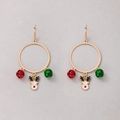Close-up of Christmas earrings with gold reindeer charms and festive colorful bells - Golden Loop Reindeer
