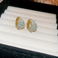 Macro detail of light blue enamel huggie earrings with gold floral zircon accents - Gold-Light Blue-3D Flower