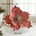Macro detail of 24cm velvet artificial magnolia flower with glitter petals for Christmas decor - Pink