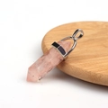 Hexagonal rose quartz point pendant with silver clasp on a natural wooden base - Resin Rose Quartz