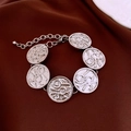 Close-up of retro silver round plate bracelet with textured patterns and lobster clasp - Silver
