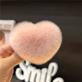 Close-up of a pink plush heart-shaped hair clip with soft Rex rabbit fur texture - Nude Pink