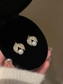Detail of gold leaf stud earrings with white pearl and sparkling zircon in a jewelry box - Pearl Leaf Studs / Gold-White