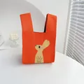 Bright orange knitted tote bag with a cute beige rabbit pattern and comfortable handle - Orange Rabbit