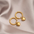 Elegant gold heart charm hoop earrings displayed on premium champagne silk fabric background - Gold