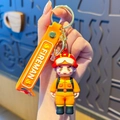 Fireman silicone keychain featuring a firefighter figure and orange 'FIREMAN' wrist strap - Firefighter-Yellow