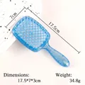 Detail van de hemelblauwe holle haarborstel met glitterafwerking en productafmetingen - Blauw - Kleine holle kam