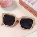 Chic beige square oversized sunglasses with dark lenses on a stylized pink background - Pink 9-Square Large Frame Milk Tea Nude Pink