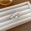 Close-up of adjustable silver butterfly ring with white pearls and sparkling zircons - Silver Intertwined Pearl Zircon