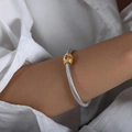 Twisted cable stainless steel cuff bracelet with gold accents and red marquise gemstone - Red Rhinestone