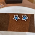 Star-shaped silver earrings with deep blue crystal center and white pavé setting - A28 Silver Star Stud Earrings