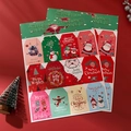 Christmas gift tags set with hand-drawn Santa and reindeer on festive red background - Set of 12