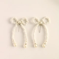 Elegant white faux pearl bow earrings with pendant drop tassels for a minimalist look - U-Shape Bow Pearl (1034) / Silver