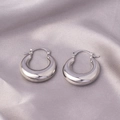 Chunky silver hoop earrings with a polished finish on elegant lavender silk fabric - E-018---Platinum