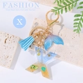 Blue resin letter X keychain with ocean beach theme, seashell details and blue tassel - Letter X