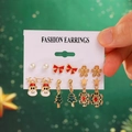 Christmas earrings set with Santa, deer, and snowflake studs on a display card - 06 KC Gold (6 Pairs Set)