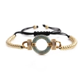 Bohemian adjustable black rope bracelet with blue stone ring and gold beads on white background - Light Blue