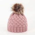 Detailed close-up of pink cable knit baby hat featuring a fluffy faux fur pompom ball - 0-12 Months / Dusty Pink