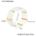 Detail view showing a white resin stretch bracelet with stainless steel gold spacers - Inner Diameter 60mm/Width 35mm / White Resin (E677)