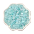 Light blue iridescent square glass beads in a white ceramic petal bowl for DIY jewelry - Light Blue