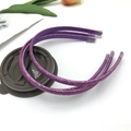 Three glittery purple hairbands with clear protective caps on white background - Deep purple