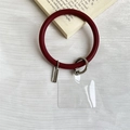 Silicone wrist strap phone charm in wine red with silver clasp and clear connector - Dark Red