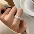 Floral silver s925 ring in a lifestyle scene with flowers and a coffee cup - 3D Small Flower Link Silver Style(JZ0734)