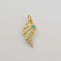 Macro view of gold-plated feather wing charm with colorful enamel and clear zircons - Multicolor Enamel Feather
