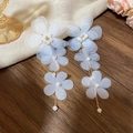 Detailed view of white mesh flower tassel earrings with gold chains and white beads - Mesh Floral Tassel Style (35#银针) / White
