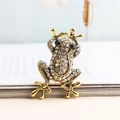 Spilla a forma di rana scintillante placcata in oro con strass e occhi in cristallo nero - Bianco