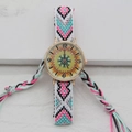 Close-up of bohemian woven strap and gold watch face with vintage mandala pattern - Yellow Green Vintage (Style 5)