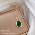 Detail shot of pear-cut emerald pendant with micro-pave diamonds and product dimensions - Gold and Green Water Drop Style (F545)