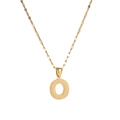 Detailed close-up of golden letter O pendant with a unique grainy textured metal finish - Letter O
