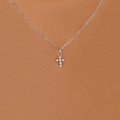 Silver cross pendant necklace with embedded stones on a delicate chain model view - Zirconia Inlaid Silver Cross (5732301)